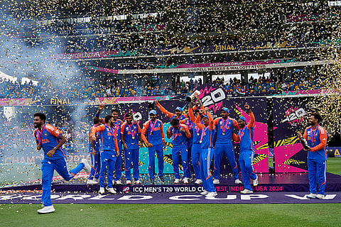 India's players celebrate with the winners' trophy